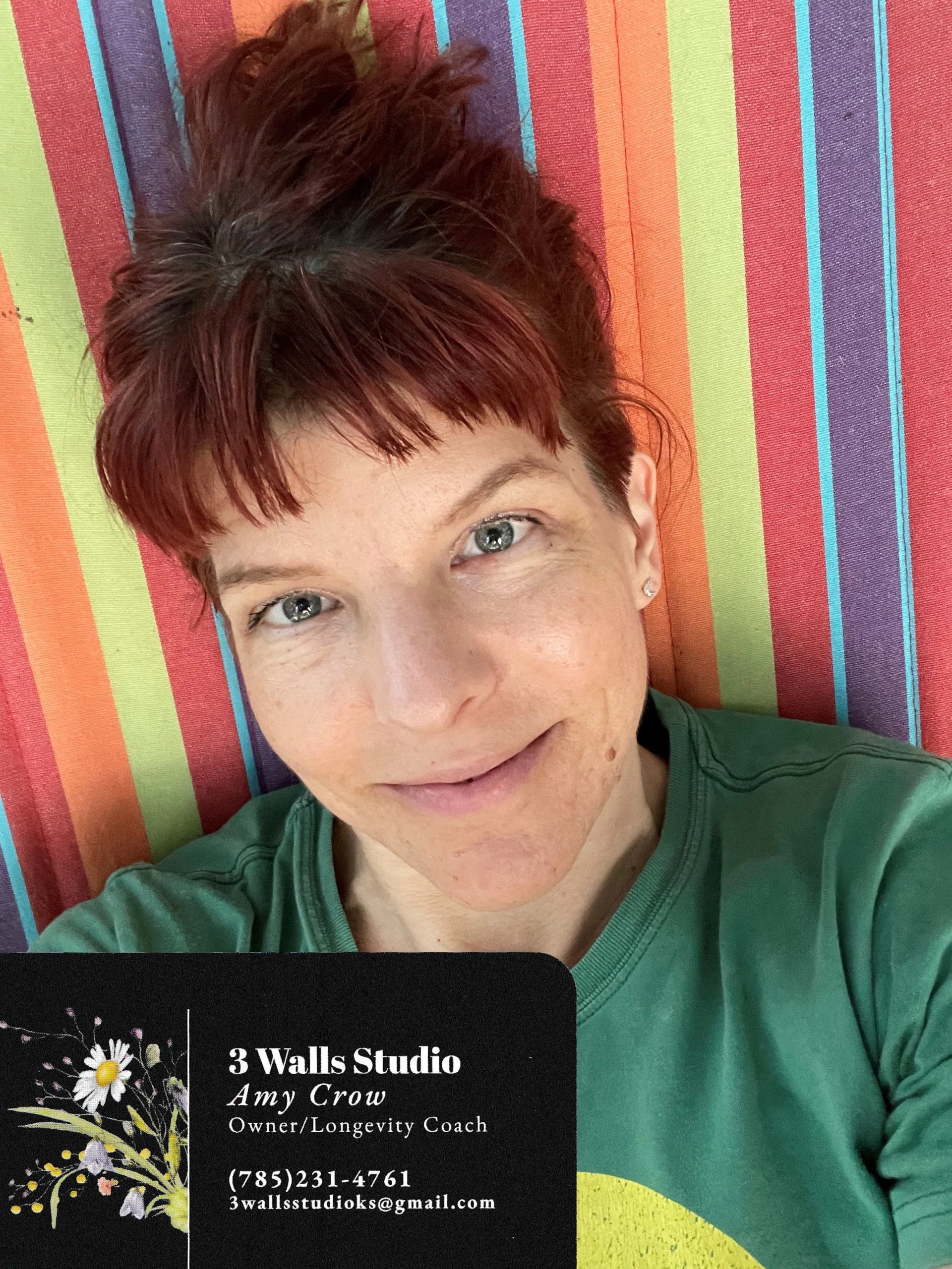 Owner of 3 Walls Studio, Amy, and business card.